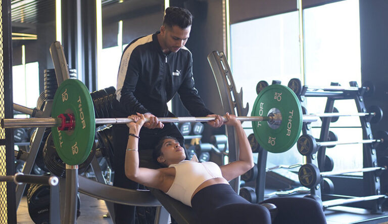 Woman performing chest workout