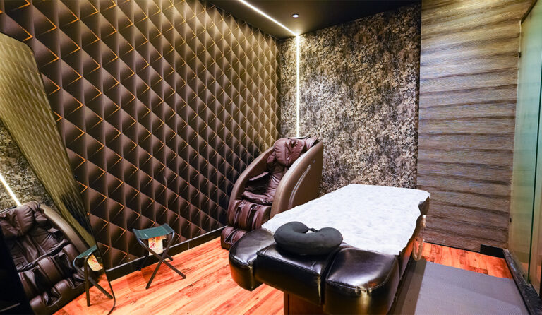 Premium wellness spa room with massage chair and therapy bed, reflecting top luxury wellness trends in India 2025