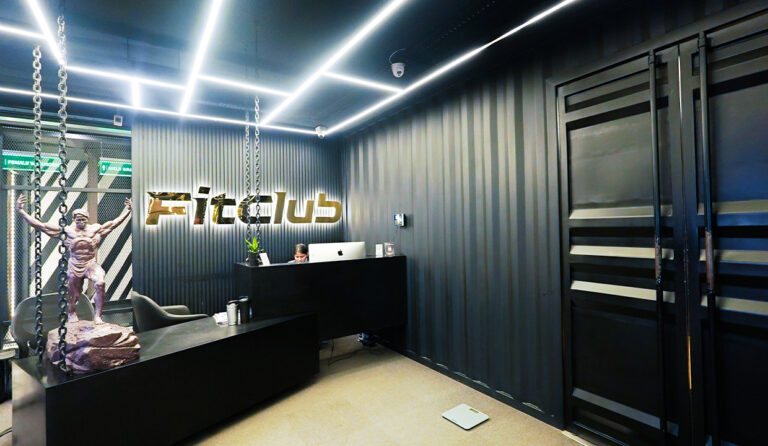 "FitClub Gurugram modern gym reception area promoting office life balance and fitness lifestyle in Gurugram