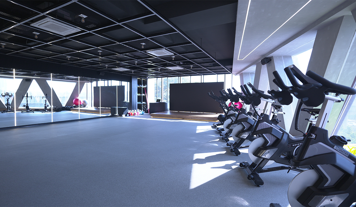 Modern premium gym with advanced equipment and personalized training facilities for fitness and heart health.