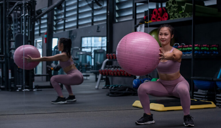 Person performing ab exercises at FitClub, the best gym in Gurgaon, to burn belly fat and achieve a toned, sculpted midsection.
