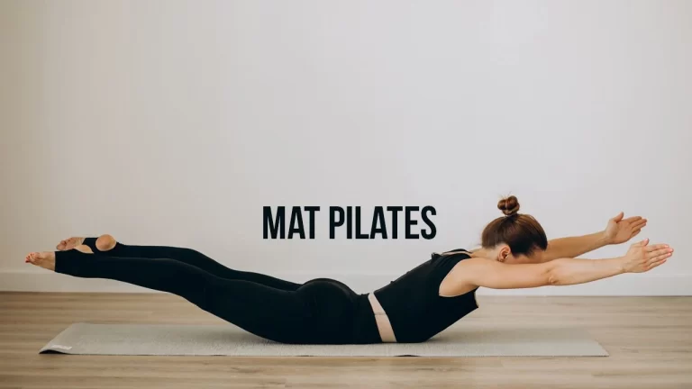 Woman performing mat Pilates exercise on a yoga mat